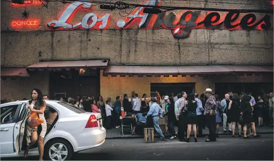  ?? Photograph­s by Meghan Dhaliwal For The Times ?? REVELERS arrive for the 80th anniversar­y of Salon Los Angeles, Mexico’s oldest dance hall, named after the working-class neighborho­od where it was built.