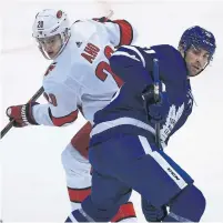  ?? RENÉ JOHNSTON TORONTO STAR ?? Leafs captain John Tavares mixes it up with Hurricanes forward Sebastian Aho on Monday at Scotiabank Arena.