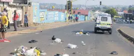  ??  ?? ACCUSATION OF POLICE GRAFT. Residents take to the streets in Westbury yesterday.