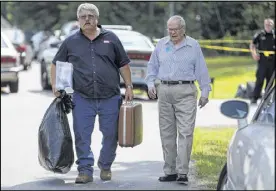 ?? BEN GRAY / AJC ?? Dewitt Todd (left) and his father, Ray Todd, head to Dewitt’s car Tuesday after having to move Ray, 89, out of Alzheimer’s Care of Commerce, which was shut down by officials. Dewitt said his father lived there for six months and he had not seen...