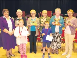  ?? Picture: David Phillips. ?? Leading trophy winners, from left: Ursula Stewart, Muriel Brown, Rattray president Margaret Watson, Elspeth Campbell, Irene Smith and Kathleen McCormick, with, at front, Amber Chapman and Henry Steel.
