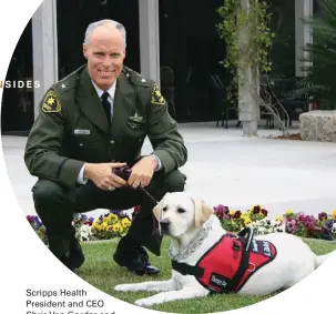  ?? SCRIPPS HEALTH ?? Scripps Health
President and CEO
Chris Van Gorder and
Libby, a trained therapy dog.
His pet often served at the hospital over the years while he volunteere­d with the San Diego County Sheriff’s Department.