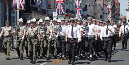  ??  ?? Military precision: Royal Marines and sailors join the rehearsal watched by thousands