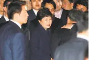 ?? AFP / Getty Images ?? South Korea’s impeached former President Park Geun-hye (center) arrives at her residence in Seoul.