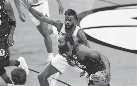  ?? AP ?? Brooklyn Nets guard James Harden drives past the New York Knicks’ Reggie Bullock during an NBA game on Monday in New York. Harden recorded his 10th triple-double of the season as the Nets won 117-112.