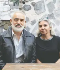  ?? CHRIS YOUNG / THE CANADIAN PRESS ?? Husam Al-Soufi and Shahnaz Al-Soufi on the patio of their Syrian restaurant in Toronto on Thursday.