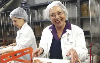  ?? FEDERICO BORELLA VIA THE NEW YORK TIMES ?? Anna Majani (center) became the creative heart of her family’s chocolate company, which was founded in the 18th century.