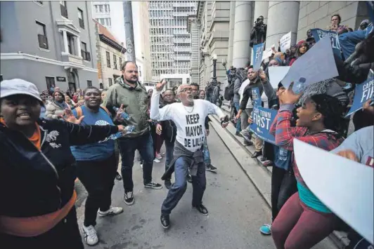  ??  ?? Troubled: The Democratic Alliance is losing supporters, in part because of internal battles, including over Cape Town mayor Patricia de Lille. Party members clashed outside the high court when De Lille appeared there in May. Photo: David Harrison
