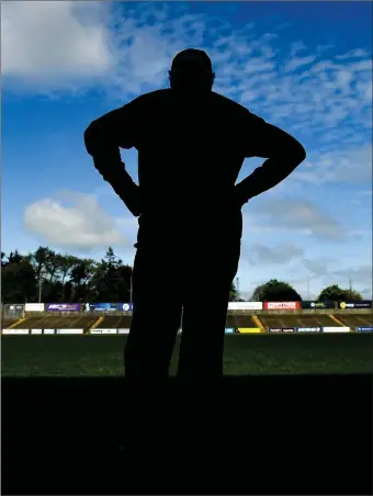  ??  ?? G.A.A. official Dave Ormonde surveys the empty pitch at Chadwicks Wexford Park on Sunday, where Wexford and Wicklow were due to meet in the first round of the Leinster football championsh­ip.