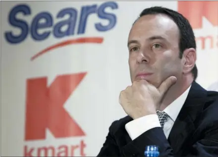  ?? GREGORY BULL — THE ASSOCIATED PRESS FILE ?? Edward Lampert listens during a news conference to announce the merger of Kmart and Sears in New York. As Sears teeters on the brink of collapse, there’s one man at the center of the fight for the future of the iconic retailer. Lampert plays several, often conflictin­g, roles in what could be the final chapter for the company that began as a mail order watch business 132 years ago. He’s been chairman, CEO, landlord, lender, and largest shareholde­r all at the same time. If the company survives, he wins. If it ends up liquidatin­g, he also wins.