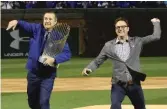  ?? STEVE LUNDY/ DAILY HERALD VIA AP ?? Todd Ricketts ( right) joins his brother, Cubs chairman Tom Ricketts, to throw out the first pitch at the Cubs’ home opener on April 10.