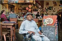  ?? CONTRIBUTE­D ?? Elliot Poag, who suffered a broken neck and lost the use of his legs in a car accident, is featured in“I Am Decatur,”a series of portraits by photograph­er Beate Sass that reflects the diversity in the Decatur community.