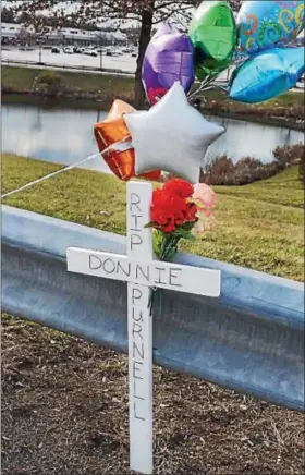 ?? DIGITAL FIRST MEDIA FILE PHOTO ?? A memorial for Donnie Purnell is set up along Route 100 at the scene where he was killed in a hit-and-run crash.