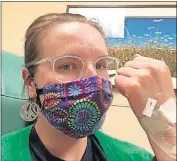  ?? ASSOCIATED PRESS] ?? This May 2020 photo shows Britta Bloomquist of Duluth, Minn., with an infusion to treat a rare type of arthritis called ankylosing spondyliti­s. [BRITTA BLOOMQUIST VIA THE