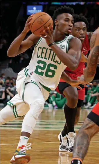  ?? STuART CAHILL pHoTos / HeRALd sTAFF FILe ?? SHOOTER NEEDS TO FIND HIS TOUCH: Aaron Nesmith, seen in a game against the Raptors in October, was sent down to the Maine Celtics this week to get some playing time after missing time in health and safety protocol.