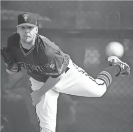  ?? ROB SCHUMACHER/AZCENTRAL SPORTS ?? Diamondbac­ks reliever Andrew Chafin throws during spring training camp on Feb. 17 at Salt River Fields near Scottsdale.