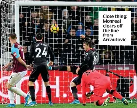  ??  ?? Close thing: Monreal clears off the line from Arnautovic