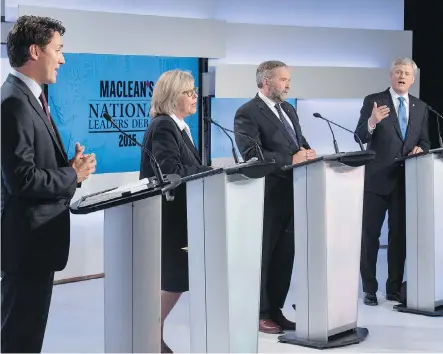  ?? FRANK GUNN/ THE CANADIAN PRESS ?? From left, Liberal Leader Justin Trudeau, Green party Leader Elizabeth May and New Democratic Party Leader Thomas Mulcair listen as Conservati­ve Leader Stephen Harper makes a point during the first leaders debate on Thursday night in Toronto.