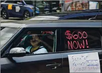  ?? MAX BECHERER — THE ADVOCATE VIA AP ?? Motorists protest in front of U.S. Sen. John Kennedy’s New Orleans office asking for the extension of $600 in unemployme­nt benefits.