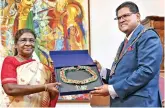  ?? ?? Murmu being conferred with Suriname’s highest civilian award by president Chandrikap­ersad Santokhi