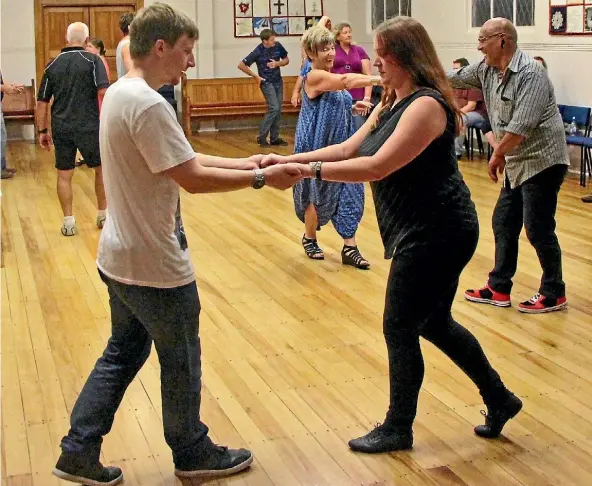  ??  ?? Reporter Emma James and her partner Jerran Carroll attempt rock ‘n’ roll dancing in Cambridge.