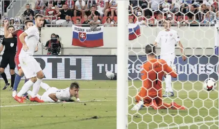  ?? PICTURE: REUTERS ?? LAST GASP: England’s Adam Lallana, far left, scores against Slovakia during last night’s Group F World Cup qualifier in Trnava, Slovakia.