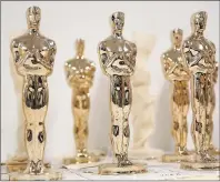  ?? CP PHOTO ?? Oscar statuettes wait to be inspected at the Polich Tallix Fine Art Foundry in Rock Tavern, N.Y., last month. Mark Chiolis has been to the Oscars four times and has sat as close as fourth row. Chiolis attended as a seat filler, a coveted position...