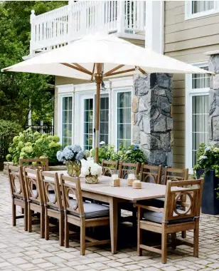  ??  ?? BELOW Meals are often served alfresco with stunning views of Lake Simcoe on the side. To visually connect the two properties, Jessica chose the same outdoor dining furniture for this space as she did for the other cottage next door. “I love how the...