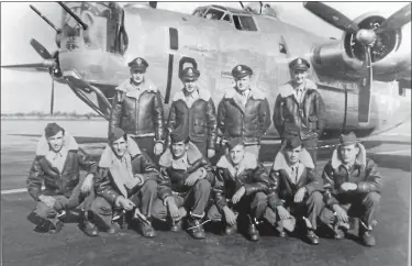  ?? PHOTOS COURTESY OF THERESA SELL ?? The 20th Reconnaiss­ance Squadron in front of their F-7 aircraft. Anthony Marchione, kneeling second from the right, was the last man to die in World War II.