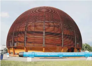  ?? — Reuters ?? The Globe of Science exhibition hall and a magnet are pictured before a news conference to launch the civil engineerin­g works for the High Luminosity LHC Project (HL-LHC) at the European Organizati­on for Nuclear Research (CERN) in Meyrin near Geneva,...