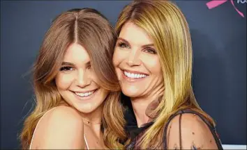  ?? Chris Pizzello / Associated Press ?? Lori Loughlin, right, with daughter Olivia Jade Giannulli. Loughlin is returning to television for the first time since she served time for her role in the college admissions scandal.