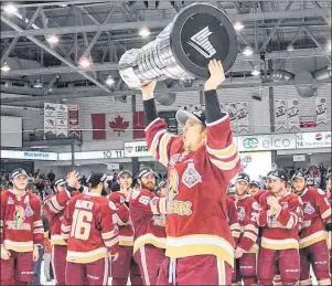  ?? PHOTO SUBMITTED/VINCENT ETHIER (QMJHL) ?? Mitchell Balmas of Sydney lifts the Quebec Major Junior Hockey League’s President Cup over his head following the Acadie-Bathurst Titan 2-1 victory over the Blainville-Boisbriand Armada in Game 6 of the league’s championsh­ip series in Bathurst, N.B.,...