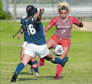  ?? SARAH GORDON/THE DAY ?? J’Naya Kelly of Mitchell College (2) blocks a pass from Fisher College’s Jillian DeLorey (16) during a women’s soccer game on Wednesday in New London. Kelly, the former East Lyme High School standout, scored as the Mariners won 1-0.