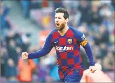  ?? Joan Monfort / Associated Press ?? Barcelona’s Lionel Messi celebrates after scoring his side’s opening goal during a Spanish La Liga match against Eibar in February.