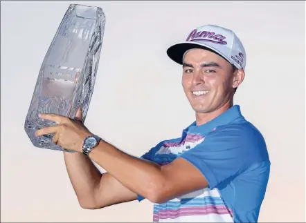  ?? PICTURE: EPA ?? MOMENT OF BRILLIANCE: American Rickie Fowler holds the the Players Championsh­ip trophy after a play-off at the TPC Sawgrass Stadium Course in Ponte Vedra Beach, Florida, yesterday.