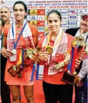  ??  ?? Shuttlers Saina Nehwal and P V Sindhu during the prize ceremony after their final match of the 83rd Senior National Women Badminton Championsh­ip in Guwahati on Saturday