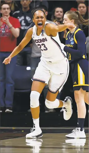  ?? Jessica Hill / Associated Press ?? UConn’s Azurá Stevens (23) reacts after a basket against Quinnipiac Monday in Storrs. The Huskies won the all-Nutmeg State matchup, 71-46.