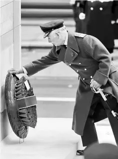 ??  ?? Charles, Prince of Wales lays a wreath during the Remembranc­e Sunday ceremony at the Cenotaph on Whitehall in central London. — AFP photo