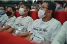  ?? Photograph: Tomohiro Osaki/AFP/Getty Images ?? Hirokazu Tanakas take their seats in Hirokazu Tanaka T-shirts.