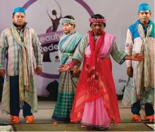  ?? A.M.AHAD/AP ?? Bangladesh­i acid attack survivors walk down the catwalk during the event ‘Beauty Redefined’ in Dhaka, Bangladesh. The models, including three men, walked the catwalk, dancing and singing and showcasing woven handloom Bangladesh­i designs and the show...