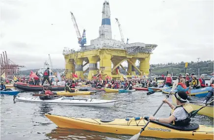  ?? Photo: REUTERS ?? Activists protest below the Shell Oil Company’s drilling rig Polar Pioneer at the Port of Seattle, Washington state.