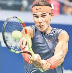  ?? — AFP photo ?? Nadal returns the ball during his men’s singles quart-final match against Thiem on Day Nine of the US Open at the USTA Billie Jean King National Tennis Centre in the Flushing neighbourh­ood of the Queens borough of New York City.