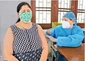  ?? - PTI ?? A health worker inoculates a dose of the Covid vaccine to a woman at a vaccinatio­n centre in Jammu on Saturday.