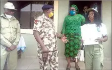  ??  ?? Mark Makafan ( left); NYSC Director General, Brig. Gen. Shuaibu Ibrahim; NYSC State Coordinato­r, Plateau, Caroline Embu; and Felicia Haruna... yesterday in Jos, Plateau State.