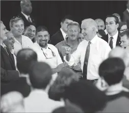  ??  ?? Left: Biden greets the crowd following his speech praising the State's RhodeWorks program Friday.
Below: The audience reacts to Biden’s remarks on Friday.