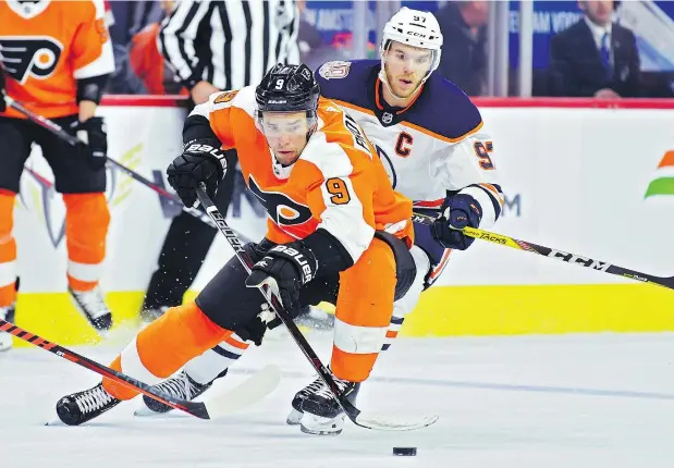  ?? DREW HALLOWELL/GETTY IMAGES ?? The Flyers’ Ivan Provorov tries to slow down Oilers star Connor McDavid Saturday at Wells Fargo Center in Philadelph­ia.