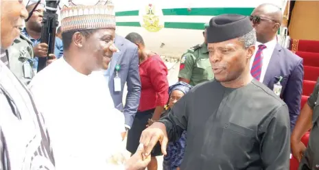  ?? Photo: NAN ?? Gov Simon Lalong of Plateau (left) welcomes Vice President Prof. Yemi Osinbajo, during the vice president’s visit to Plateau State yesterday.