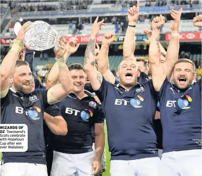  ??  ?? WIZARDS OF OZ Townsend’s Scots celebrate with Hopetoun Cup after win over Wallabies