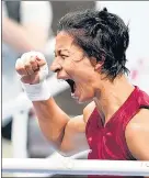  ?? PTI/AP ?? (Left) PV Sindhu screams in excitement after her win against Japan’s Akane Yamaguchi; Lovlina Borgohain reacts after defeating NienChin Chen of Chinese Taipei in the women's welter weight 69kg quarterfin­al boxing match at the Tokyo Olympics on Friday