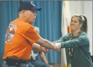  ??  ?? Lodi Police Partner Lt. Stan Sogsti demonstrat­es how to get away from a bully, played by teacher Krystine Tonetti, as the Lodi Crime Prevention Team and Lodi Police Partners give a presentati­on at George Washington Elementary School in Lodi on Tuesday.